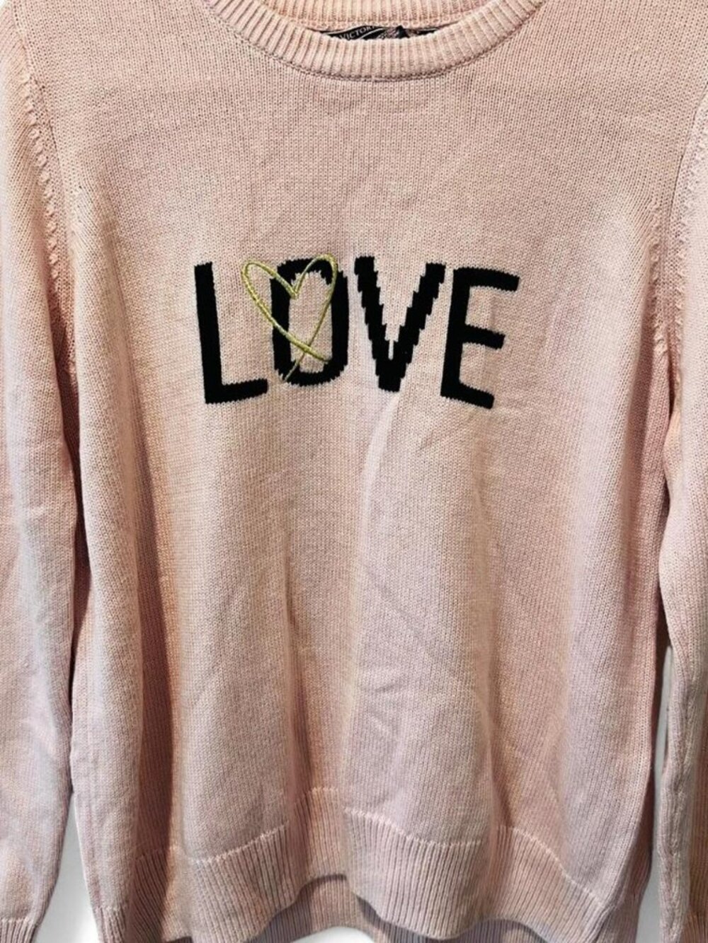 Pink sweater with black 'LOVE' text and gold heart graphic large